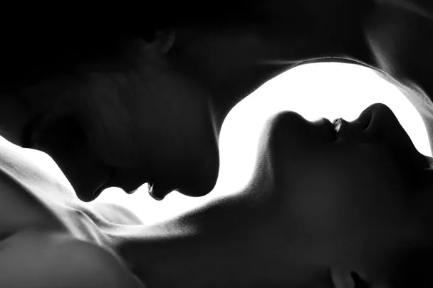 Two women embracing in black and white