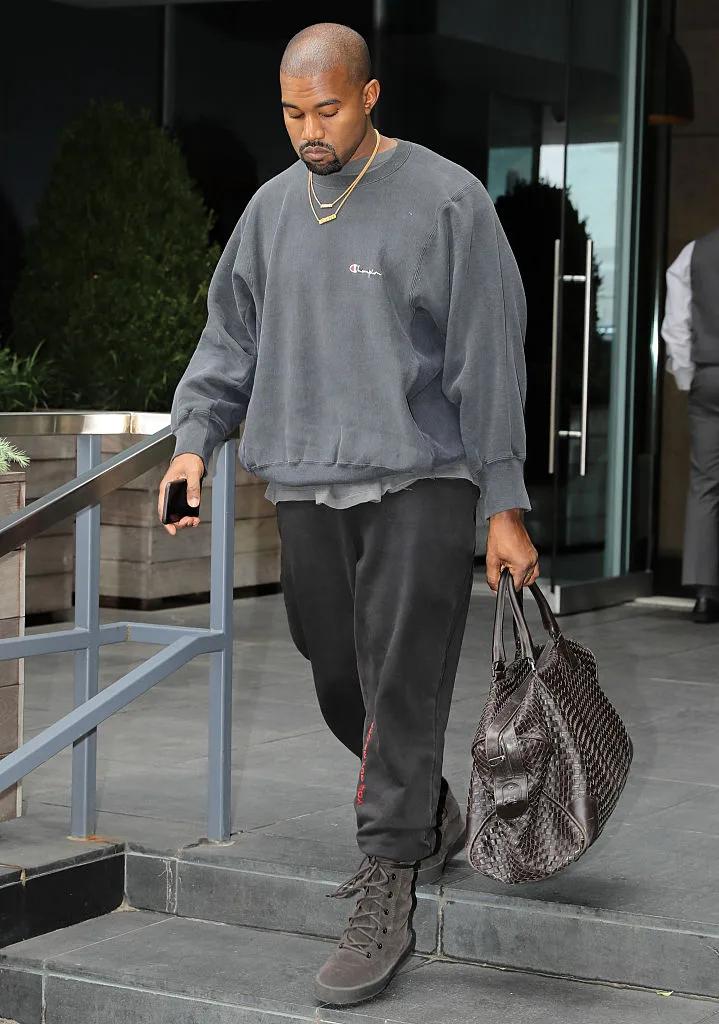 Kanye West in Timberlands and baggy sweats