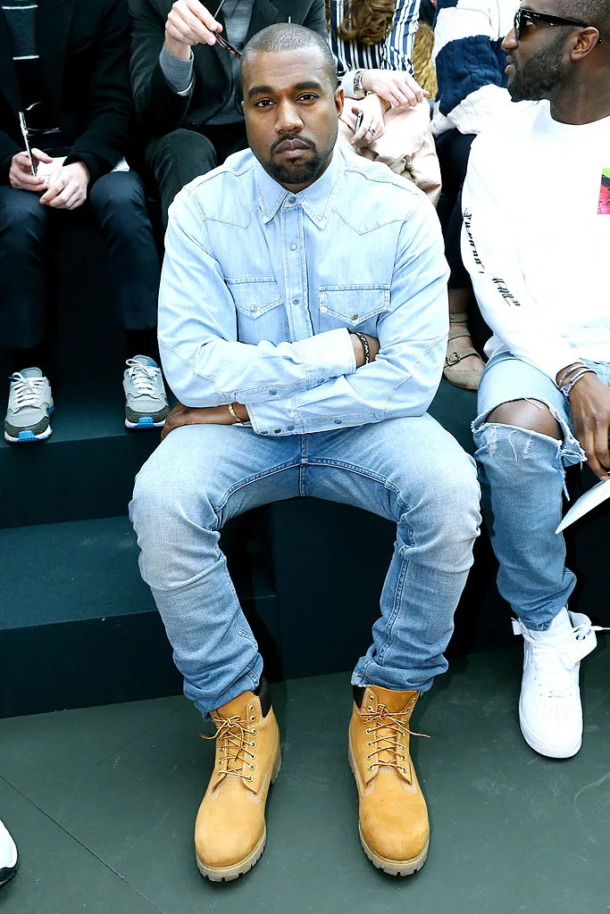 Kanye West wearing a denim shirt with denim jeans