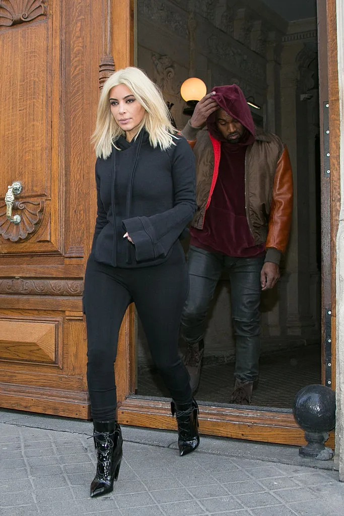 Kim Kardashian and Kanye West leaving a building in Paris, 2015