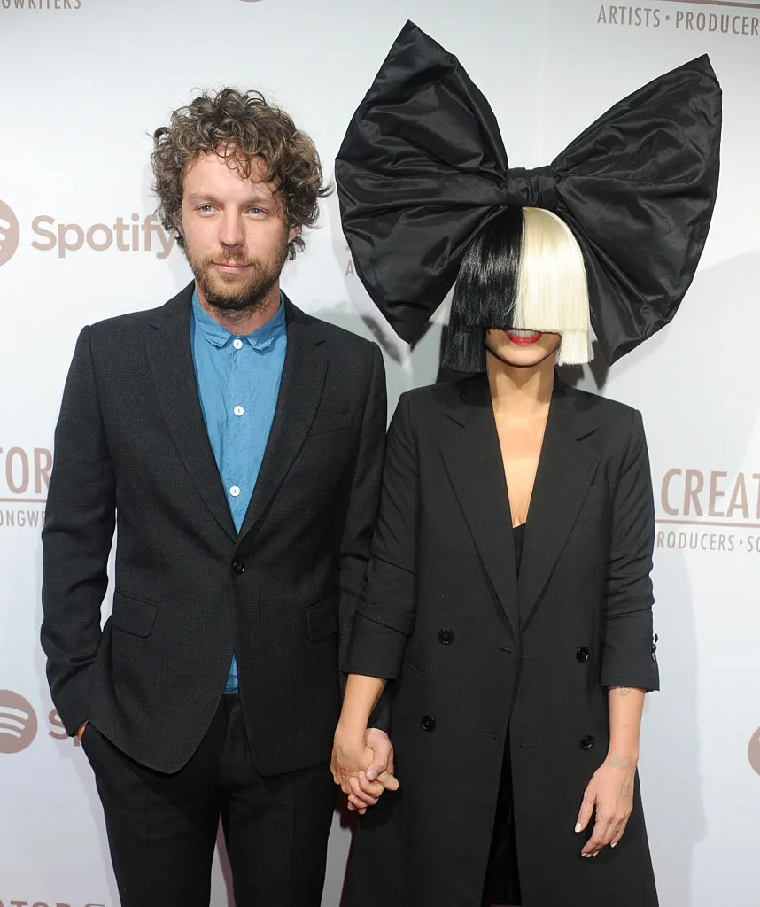 Sia standing with her producer, Erik Anders at The Creators party