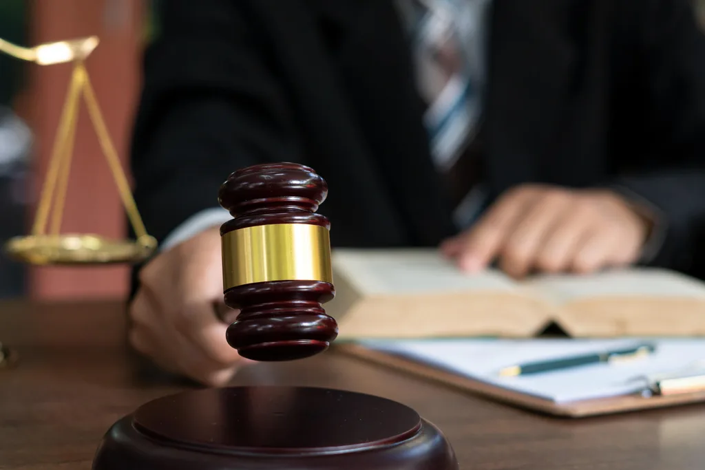 Judge striking hammer while declaring a sentence