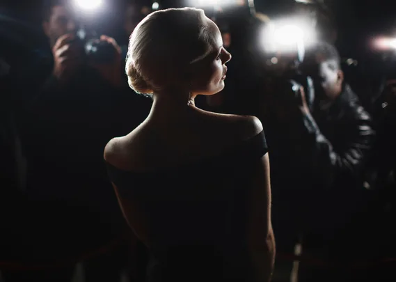 Paparazzi photographing a celebrity