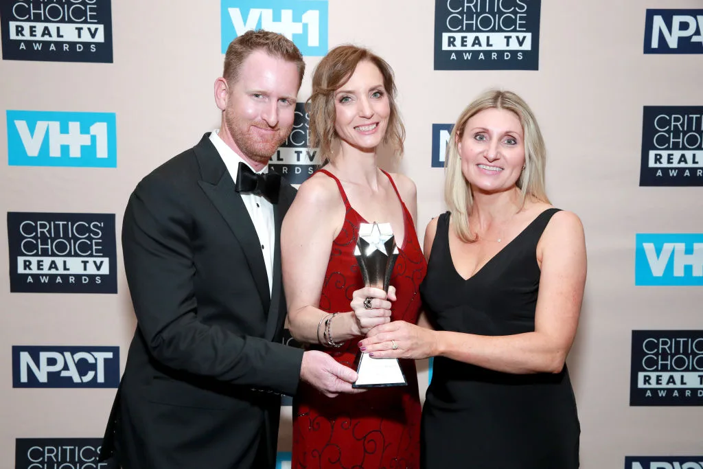 Married at First Sight producers holding the 'Best Relationship Show' award at the Critics' Choice Real TV Awards