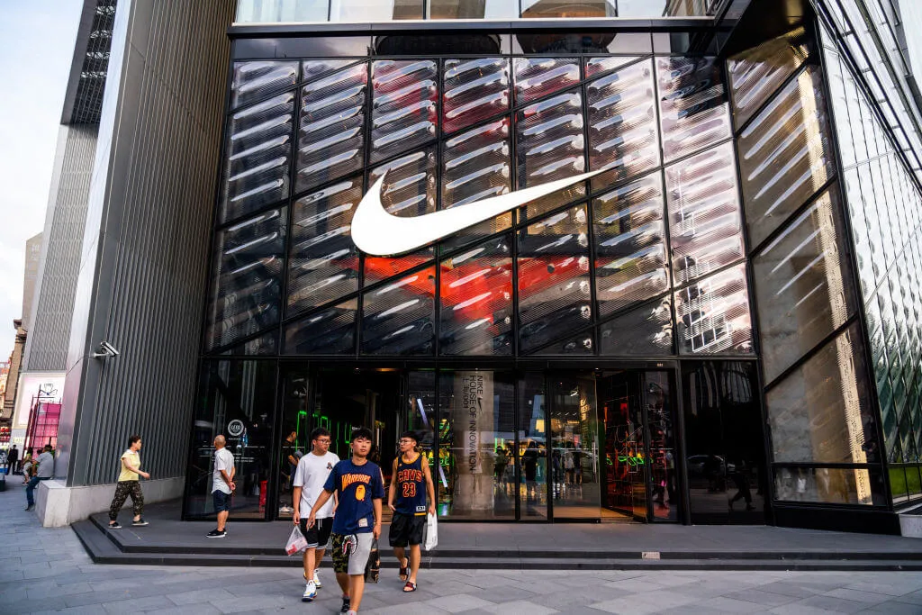 Nike shop with customers walking out carrying bags