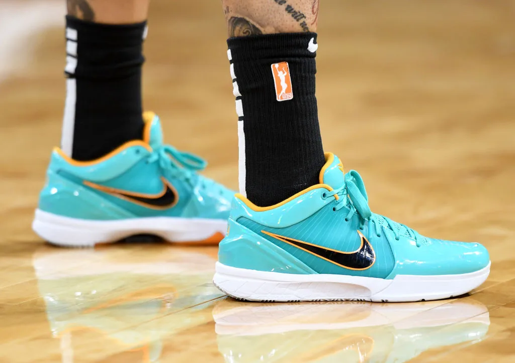 Basketball player Tamera Young wearing light blue Nike sneakers