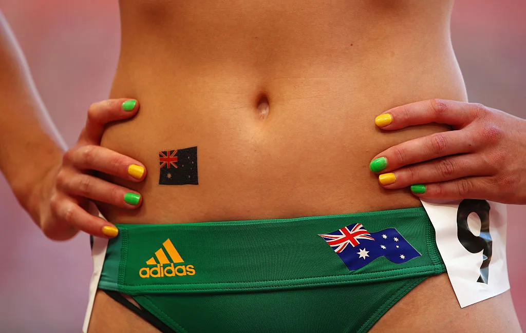 A closeup photo of Australian athlete Michelle Jenneke wearing a green sports clothing