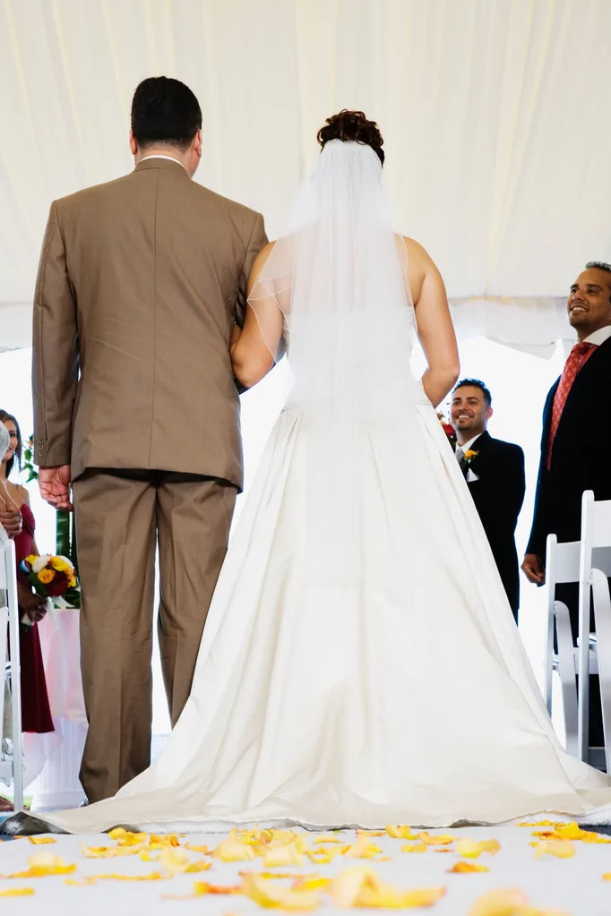 A bride and groom walking down the aisle