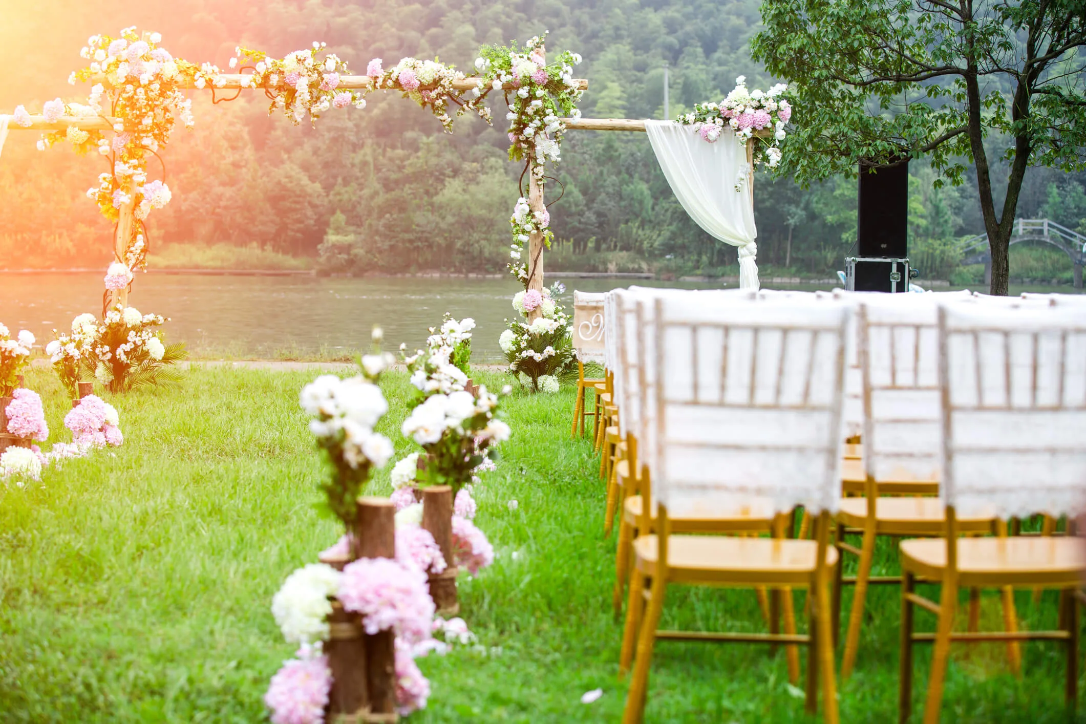 A wedding venue with a sun-flare