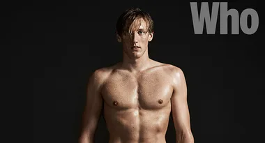 Shirtless man with wet hair stands against a dark background; "Who" magazine logo is visible.