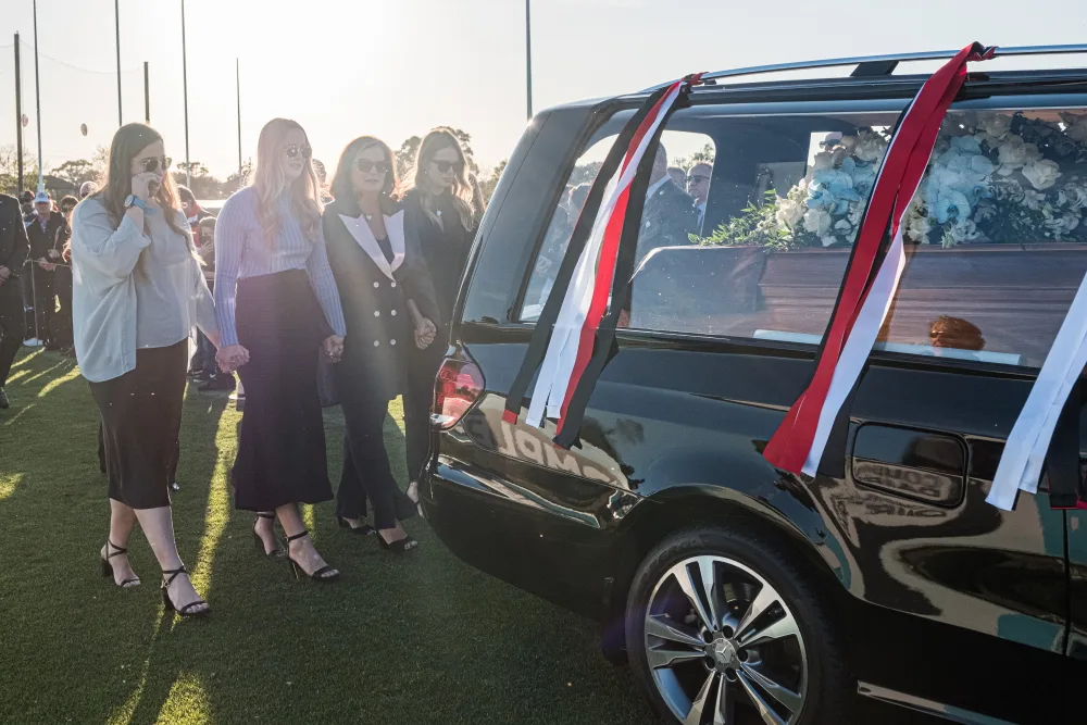 Danny Frawley's wife and daughters follow coffin at his funeral