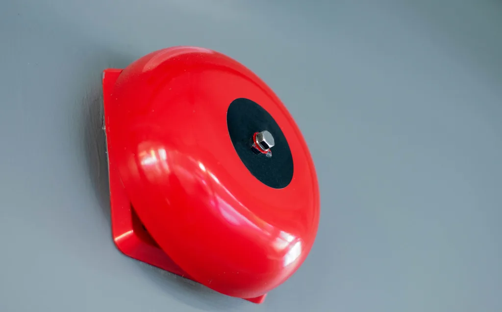 A bright red school bell