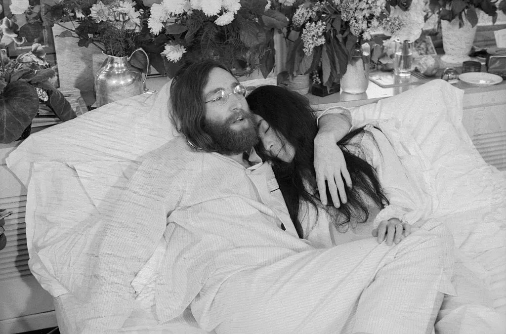 John & Yoko lying in bed together