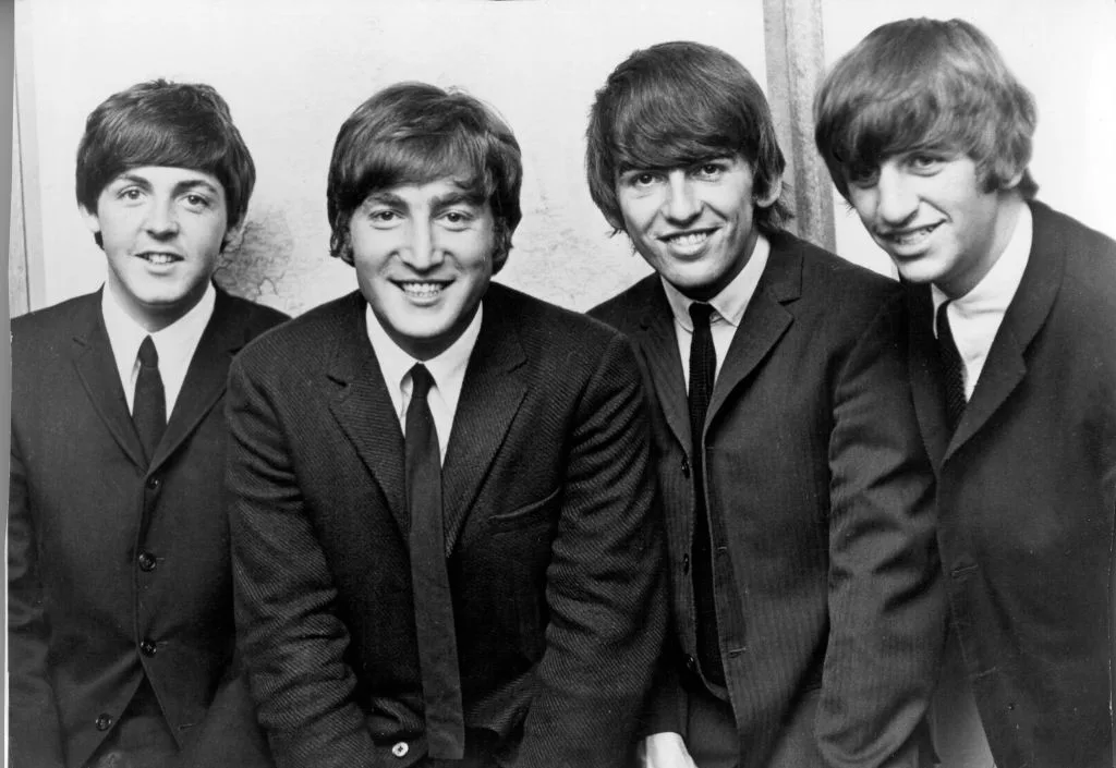 A black & white photo of the band, The Beatles