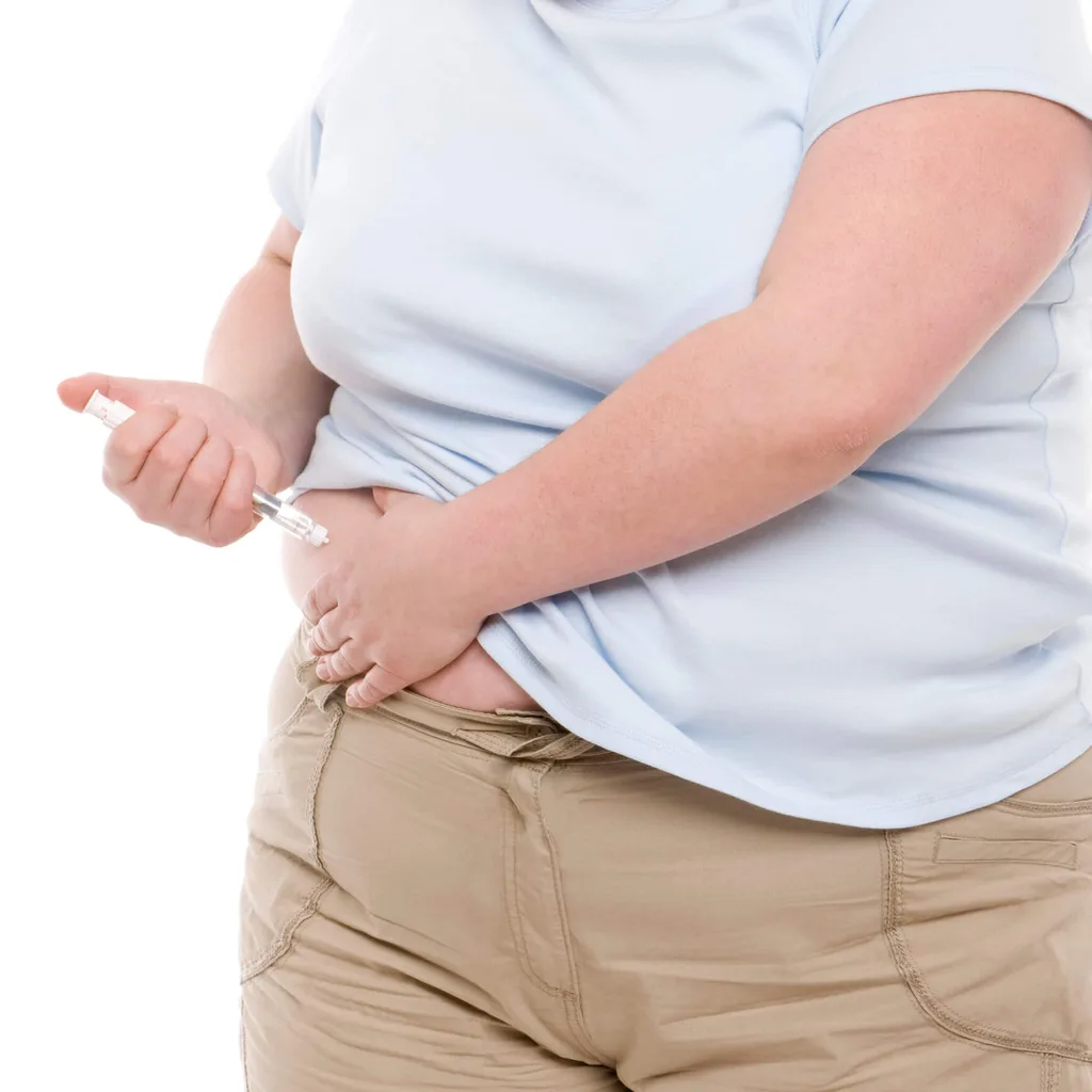 Person injecting themself with an insulin pen