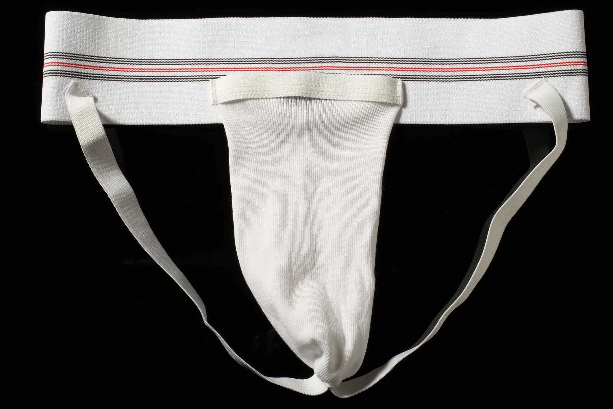 Jock strap against a black background