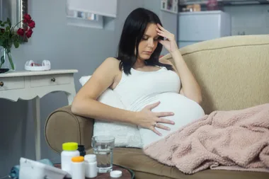 A pregnant woman with morning sickness and a headache