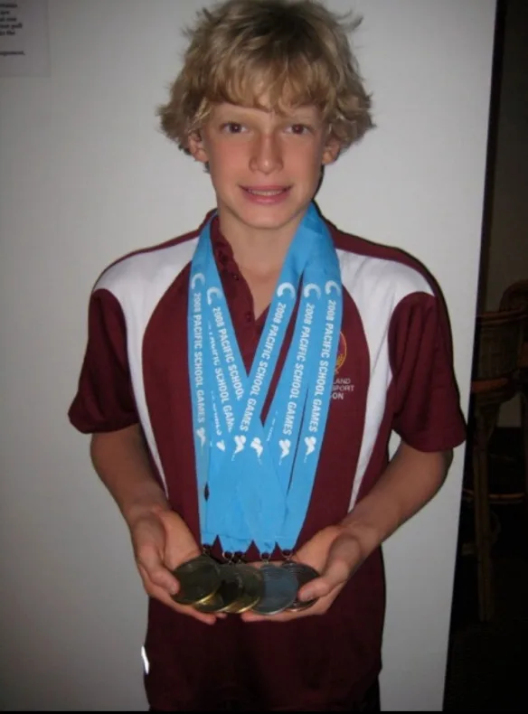 Cody Simpson as a boy with his swimming medals