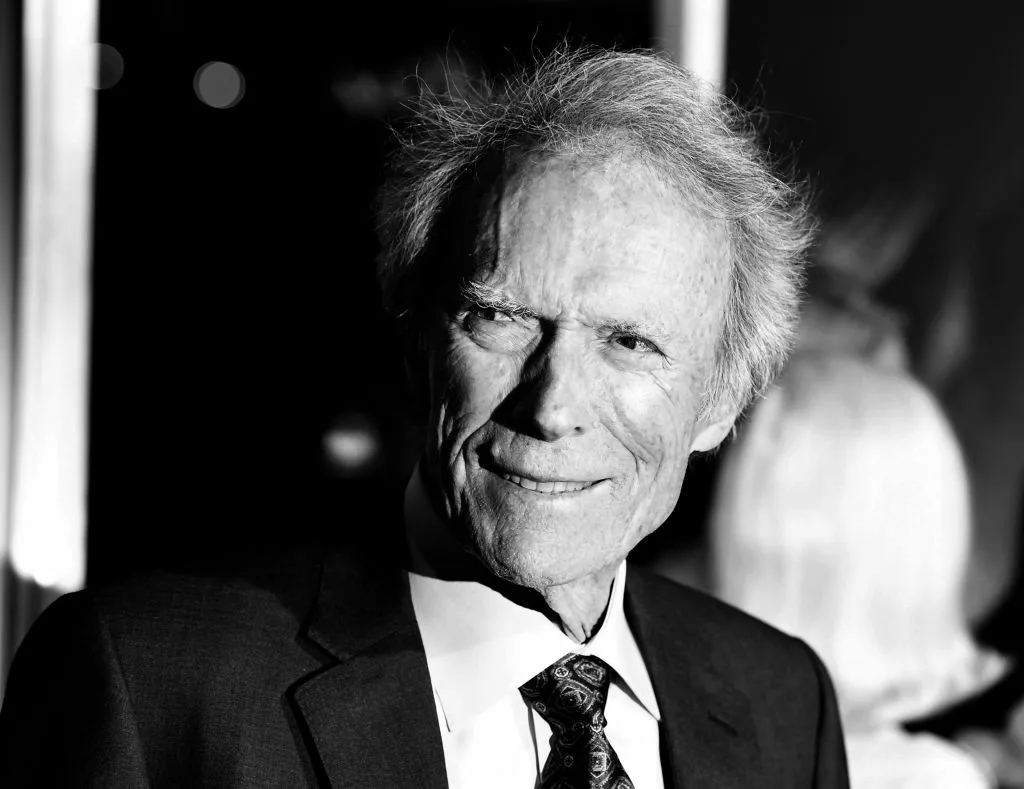 A black and white portrait of Clint Eastwood