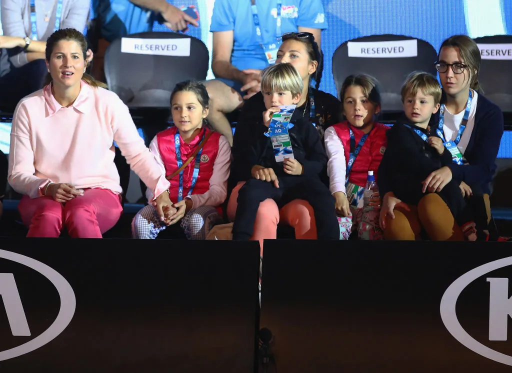 Mirka Federer and her four children watching husband Roger Federer take part in the Kids Tennis Day