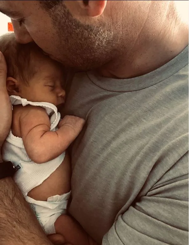 Proud papa: Jake shared this shot with Frankie