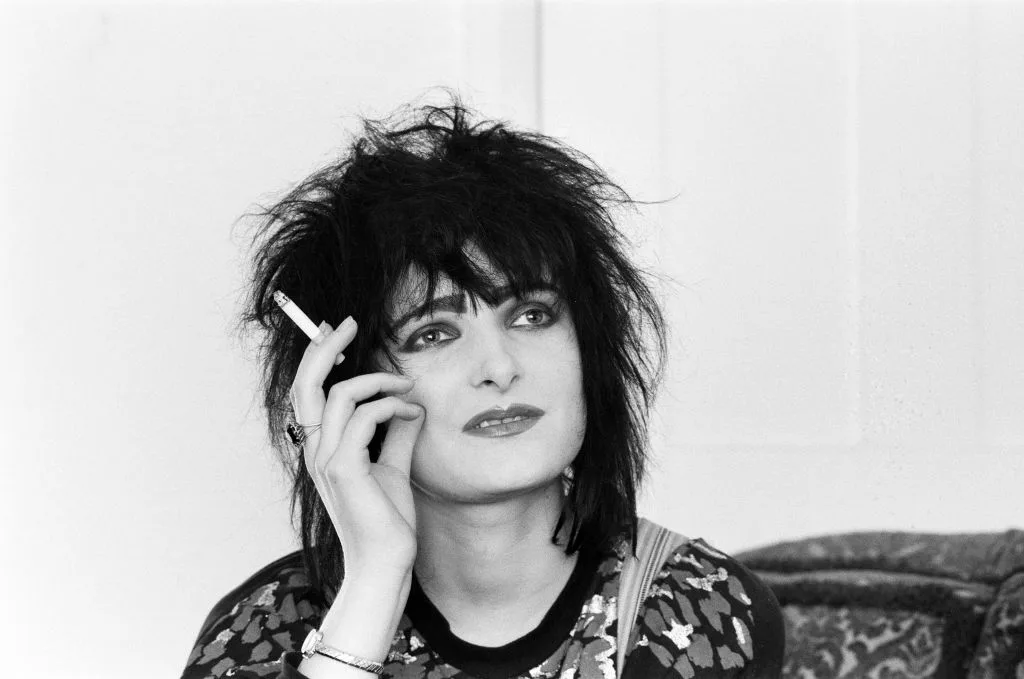 A black and white portrait of Siouxsie Sioux