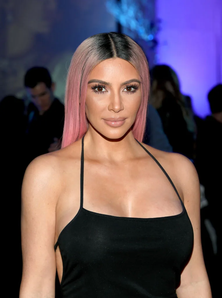 Kim Kardashian with pink and black hair attending the release of Marina Acton new album, 