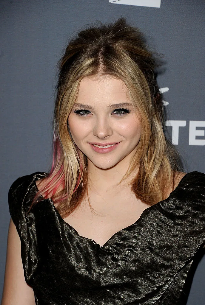 Chloe Grace Moretz with pink hair extensions