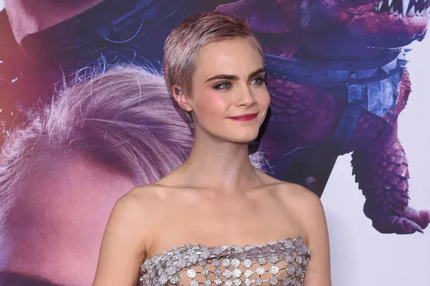 Cara Delevingne with pink hair pictured at the City of a Thousand Planets film premiere