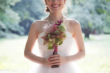 Woman holding flowers and smiling