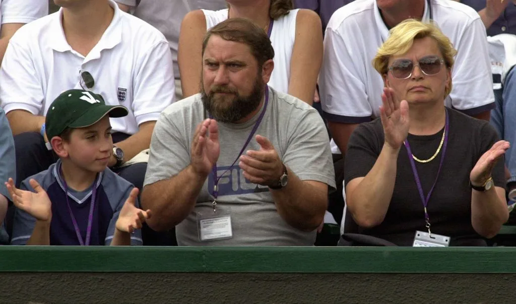 Jelena Dokic's brother Savo, father Damir and mother Liliana watching her playing during her match at the Wimbledon 2000 tennis tournament against US player Kristina Brandi in July 2000