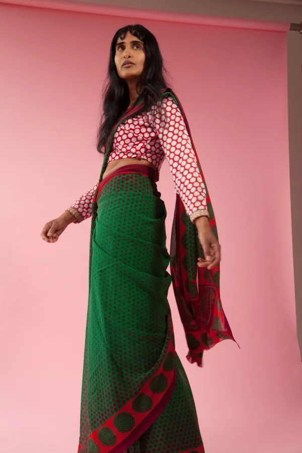 A woman wearing a patterned saree
