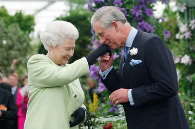 Prince Charles kissing the Queen Elizabeth II's hand at the Chelsea Flower Show