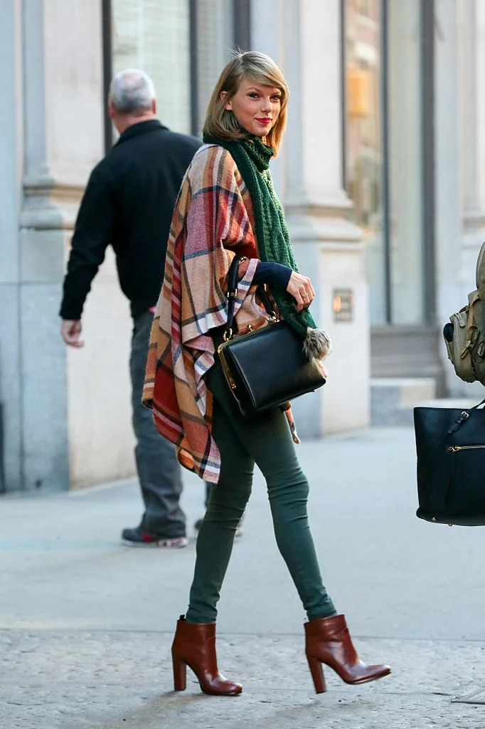 Taylor Swift spotted wearing brown shoes, green jeans and a green scarf
