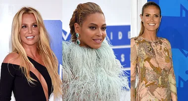 Image of three women at an event, each in stylish outfits, against a blue background.