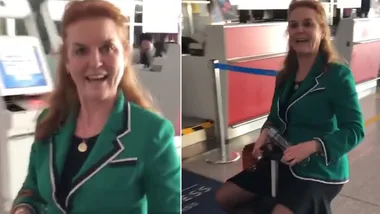 Sarah Ferguson rides through Beijing airport on electric suitcase
