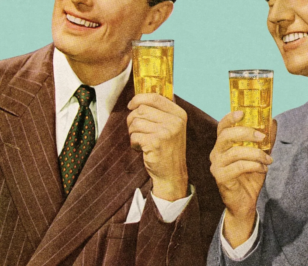 Two men holding alcolic drinks