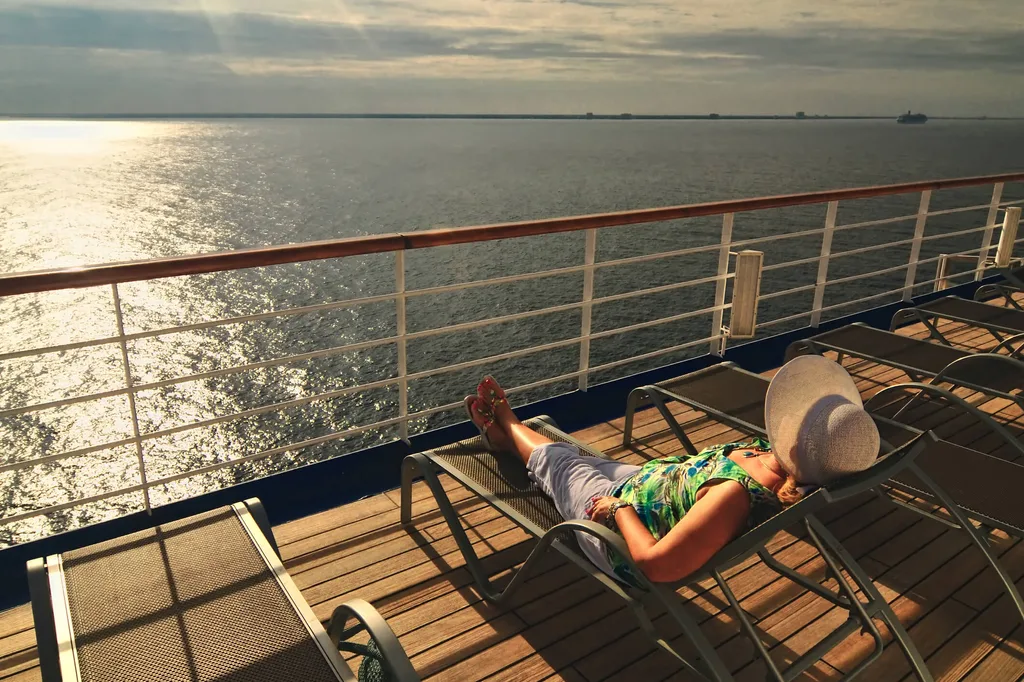 A woman sunbathing on a cruise ship