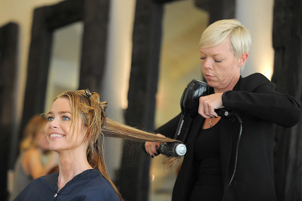 Denise Richards getting a haircut by celebrity hairstylist Tabatha Coffey in a hairdressing studio