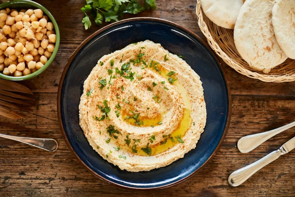 A bowl of hummus with olive oil