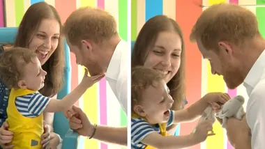 Cute toddler plays with Prince Harry’s beard
