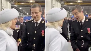 Camilla laughs with Bear Grylls as she boards HMS Prince of Wales