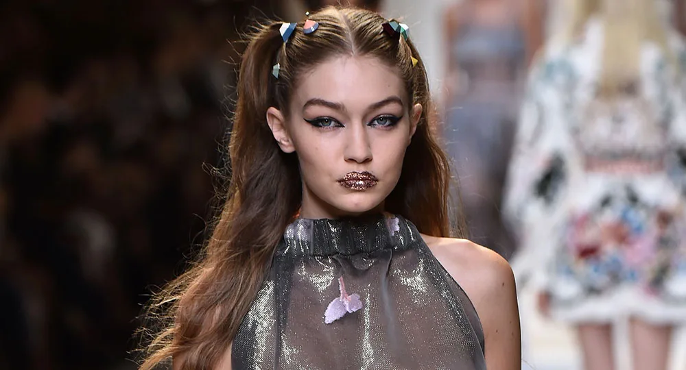 Gigi Hadid exposes her bare breast during Milan Fashion Week