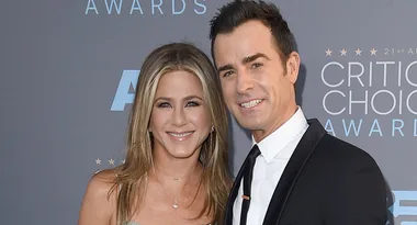 A smiling couple poses at the 21st Critics' Choice Awards.