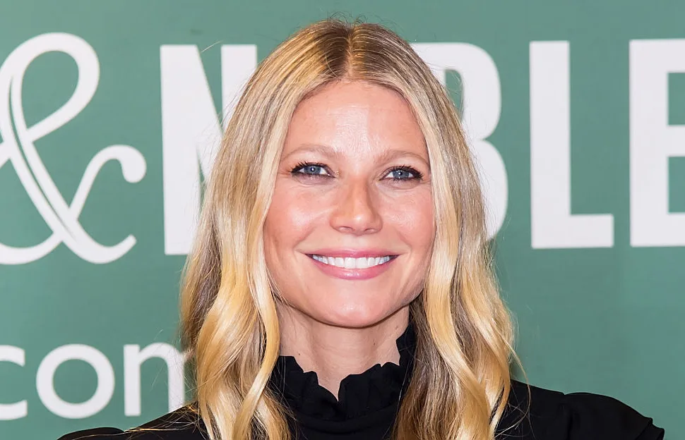 I don’t know who this is, but they're smiling and standing in front of a green Barnes & Noble background.