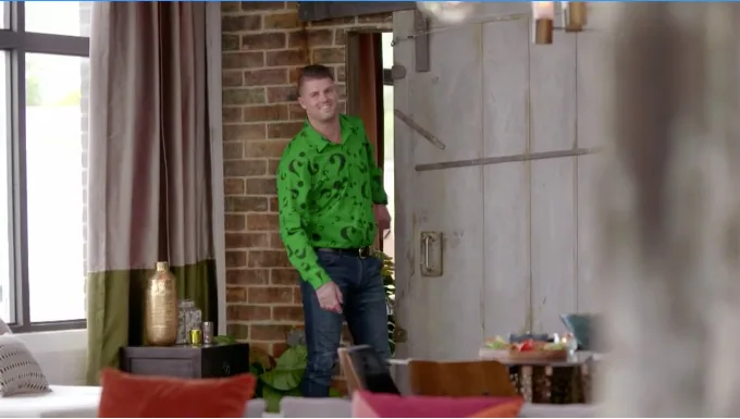 Clearly taking fashion inspiration from Batman character The Riddler, the shirt was bright green and had a print made up of various-sized question marks on it.