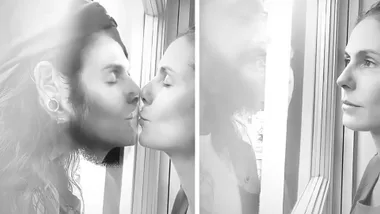 Heidi Klum and husband kiss between glass during quarantined