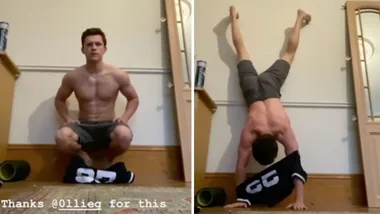 Tom Holland tries putting his shirt on while doing a handstand