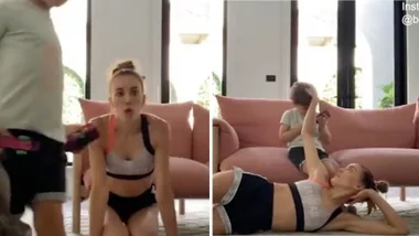 Bec Judd struggles to film pilates workout with her children around