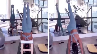 Nicole Scherzinger does the upside-down splits in workout video